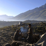 At their campsite, a father and son drinking chay on the morning of Polo Final at Shandur Pass, Chitral province, Pakistan.